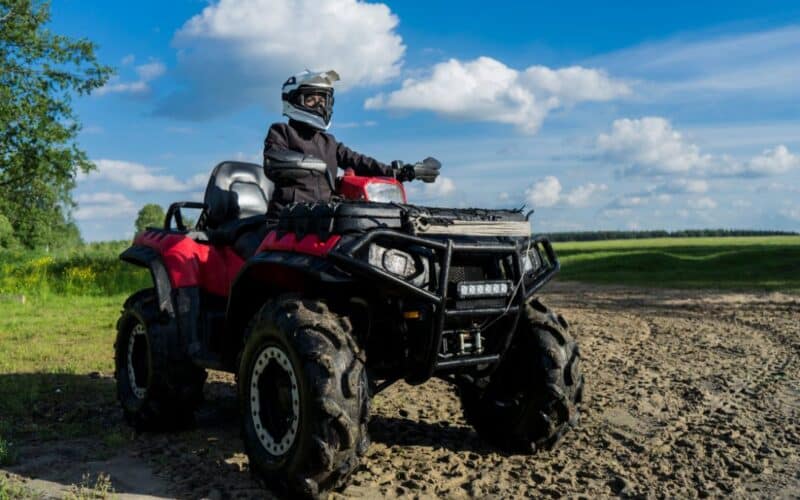 ATV with rider in field