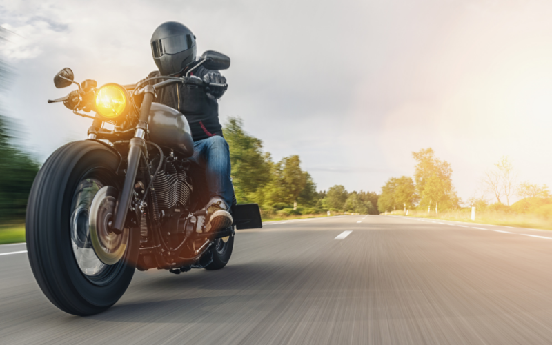 Motorcycle driving down a highway