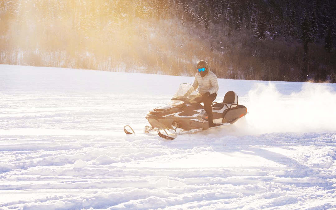 rider on snowmobile in snow