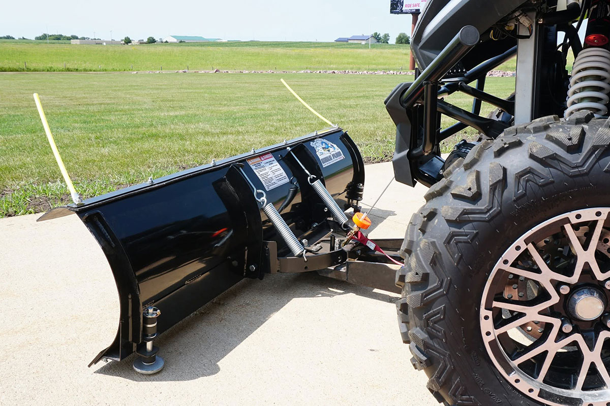 Eagle ATV plow winch lifting a snow plow blade on an ATV